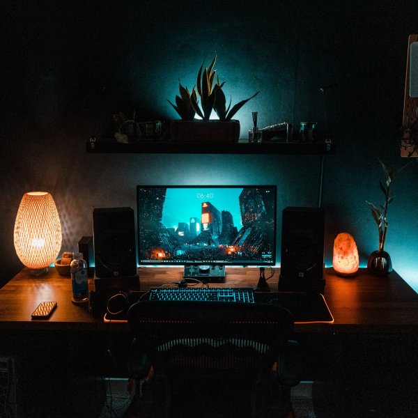 black flat screen computer monitor on brown wooden desk